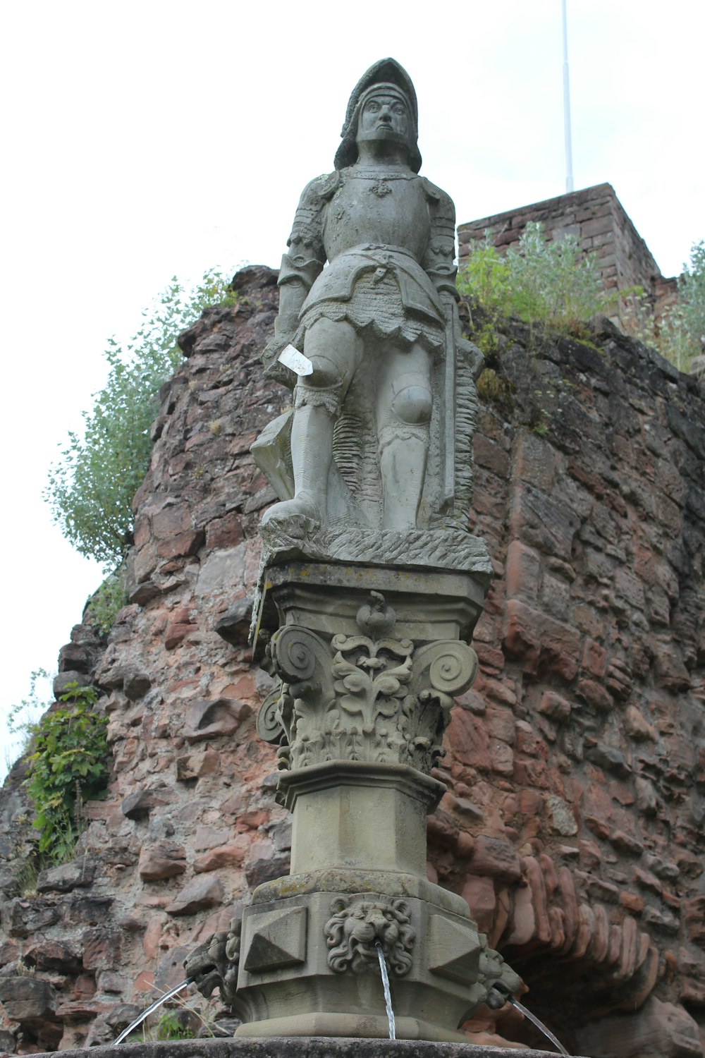 statue near mountain