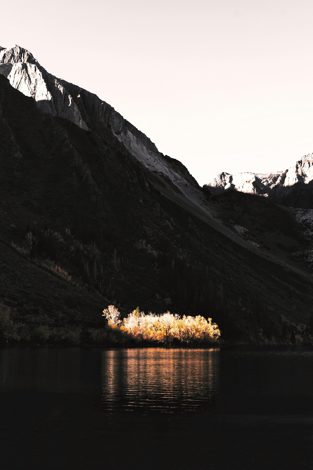 mountain near the body of water during daytime