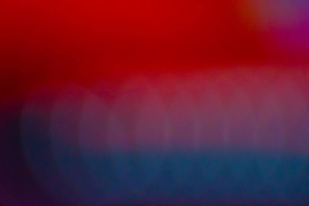 a blurry image of a red and blue background