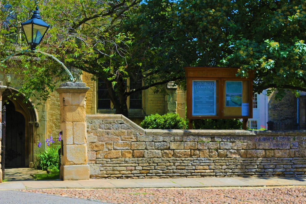 bricked wall beside pathway