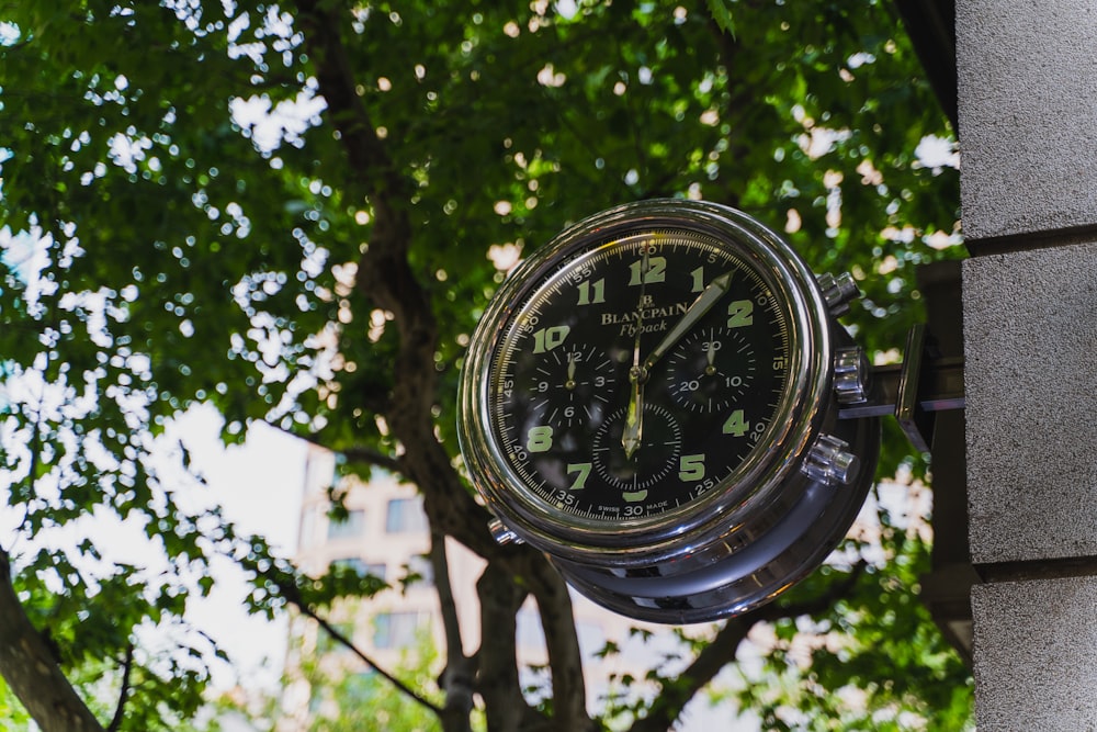 round clear and black chronograph electric meter