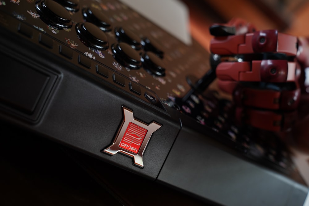 a close up of a keyboard with a red sticker on it
