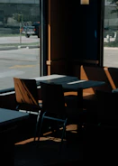 Photographer capturing a cozy restaurant dish with natural light streaming in.