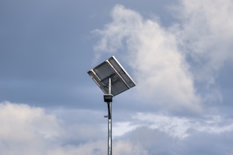 a  solar panel for pools in front of a cloudy sky