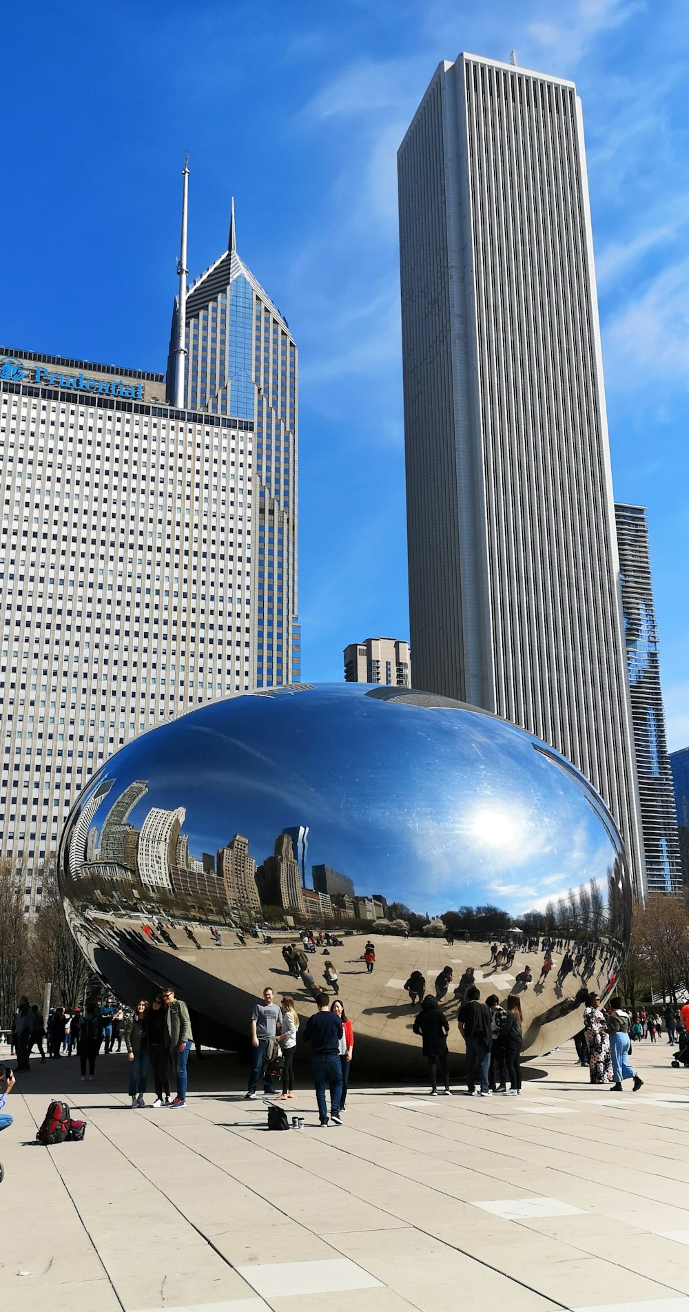 people standing near grey concrete building during daytime