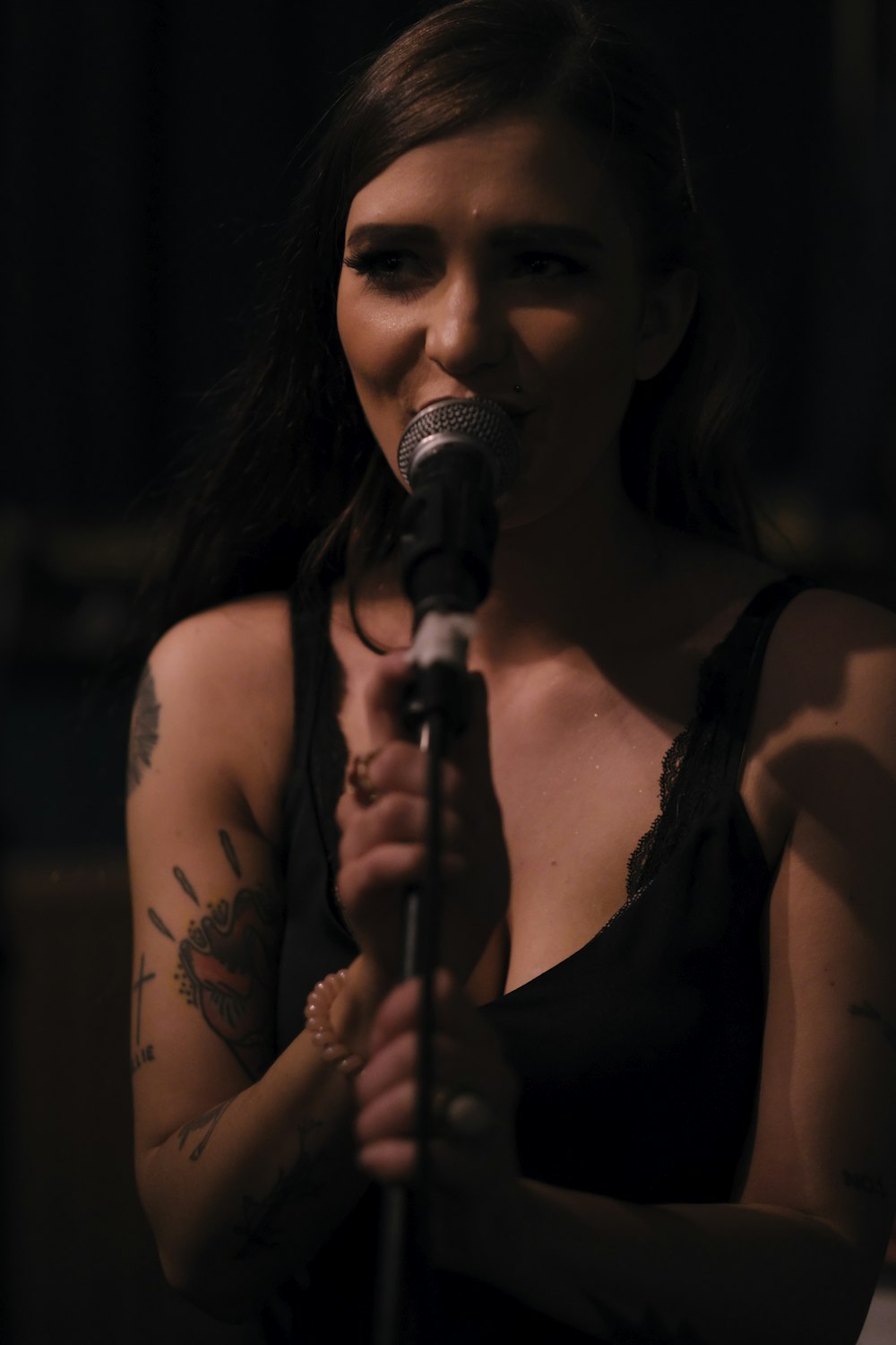 woman holding microphone