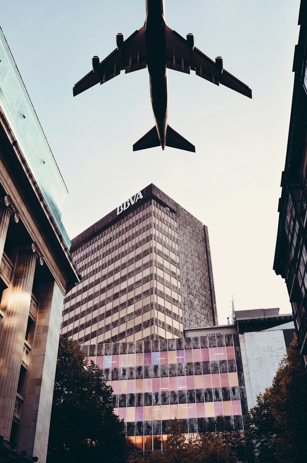 airplane above buildings