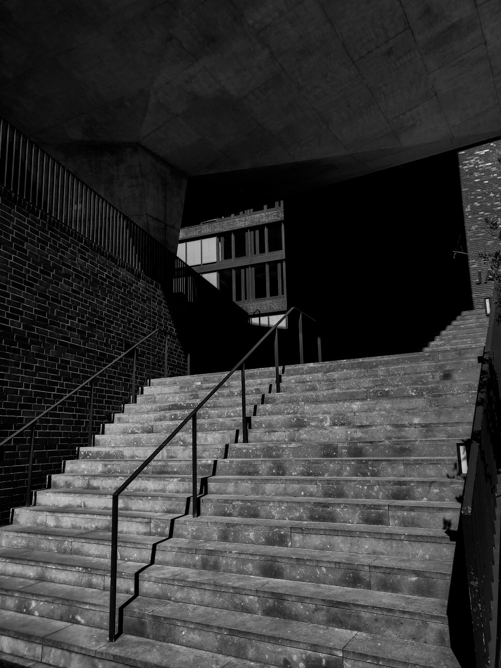 grayscale photography of concrete staircase