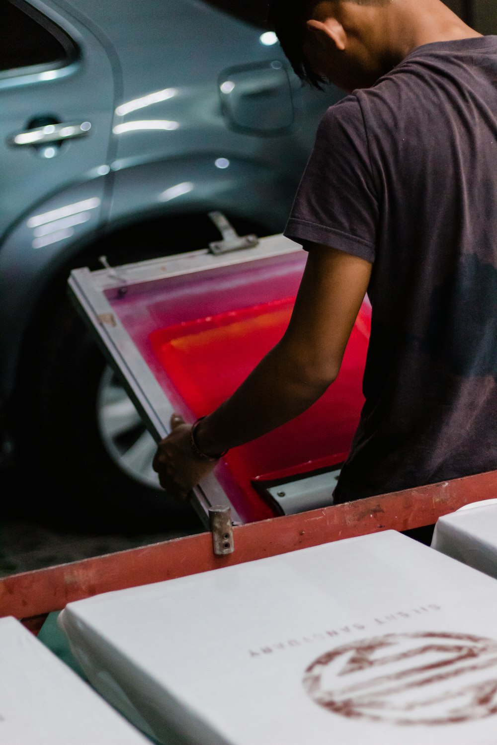 man holding silk screen