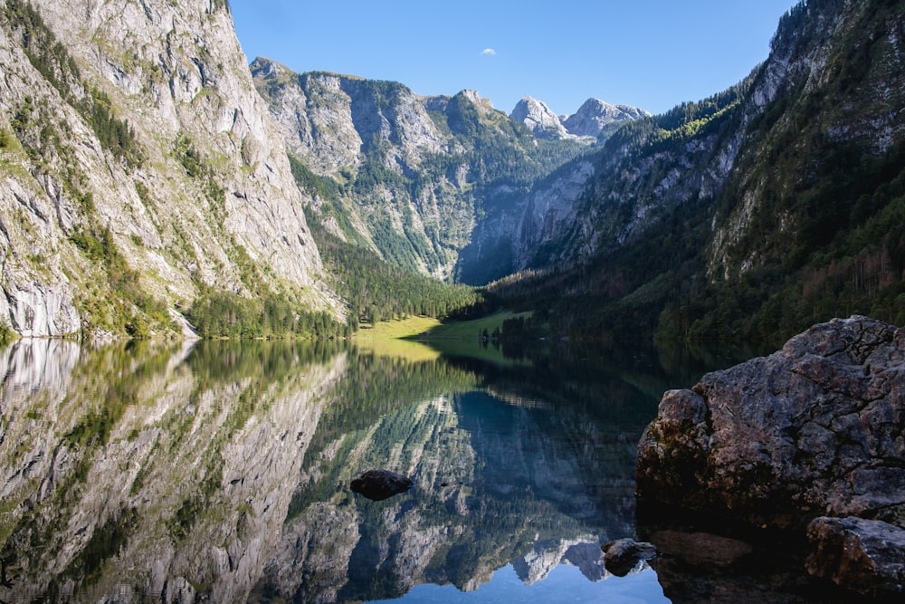 mountain showing river under blue skies