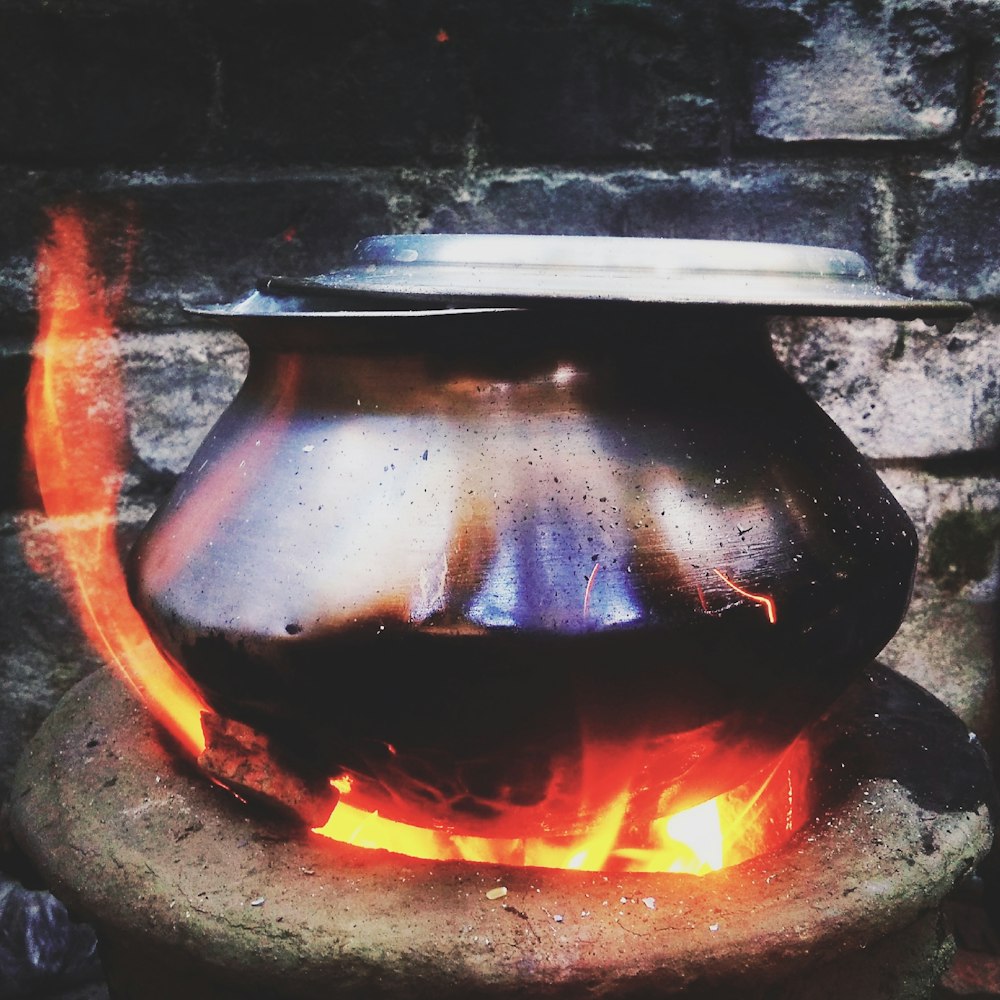 metal pot on clay stove