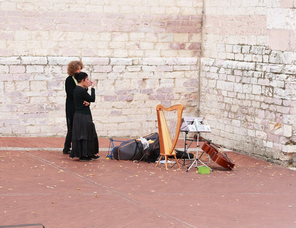 woman standing beside man near instruments
