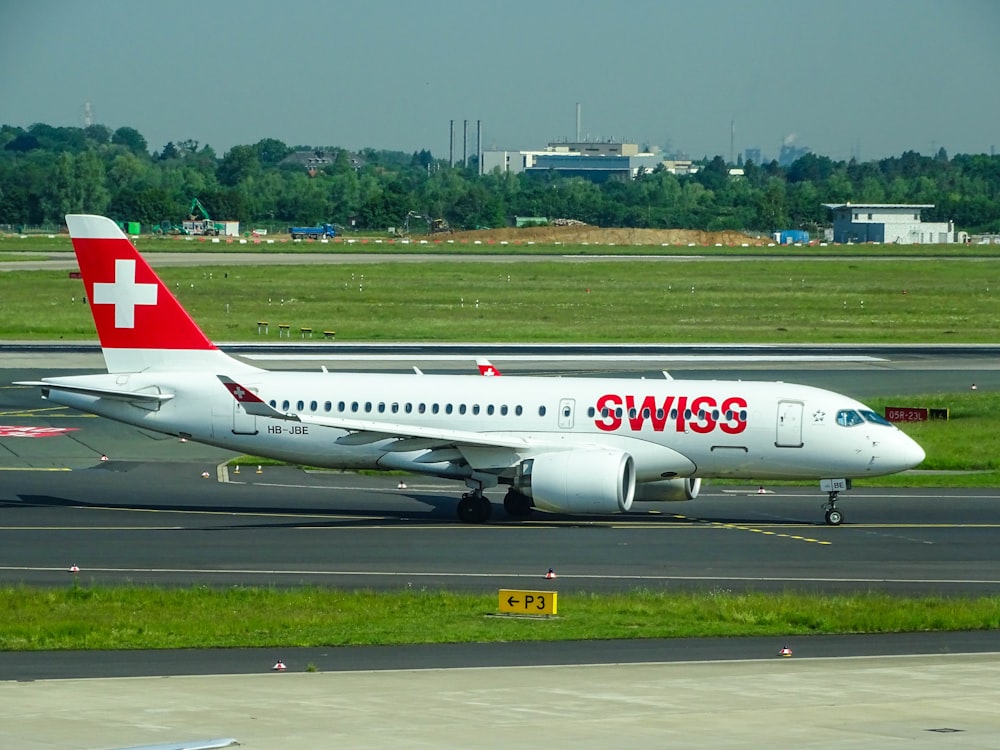 white and red Swiss airplane