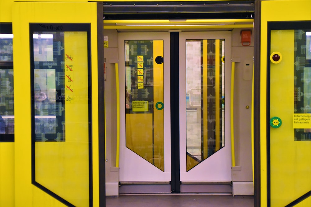 closed yellow and white train door