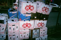 Stacked boxes ready for delivery, branded subtly with the UFO Apparels logo.