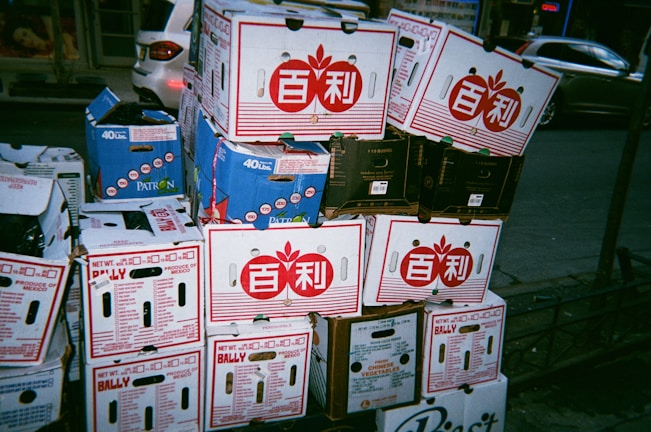 Stacked boxes ready for optimized route delivery to various local businesses