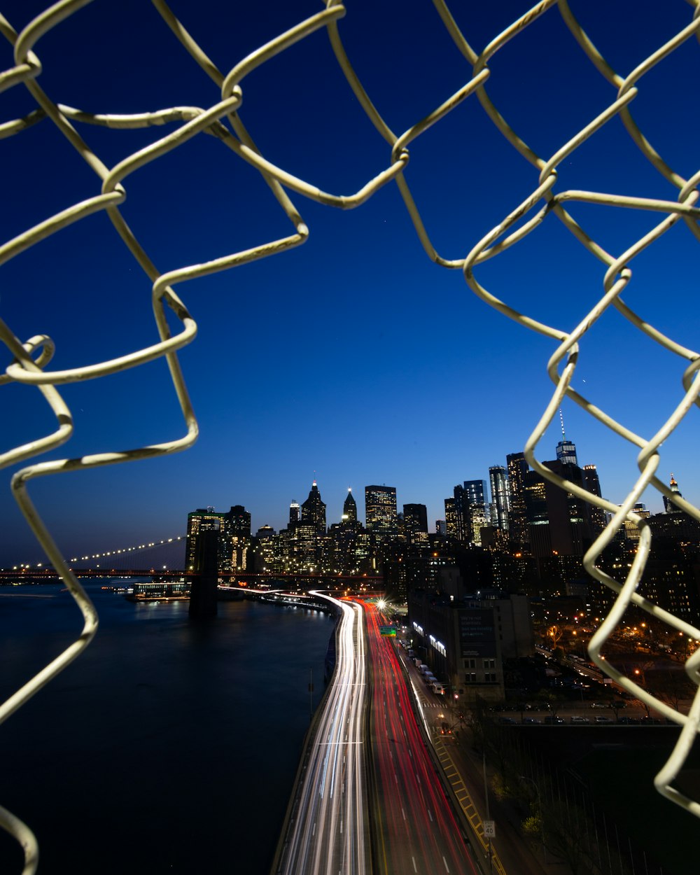 gray metal chain link under blue sky