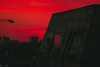A wide shot of a restored commercial building roof at sunset