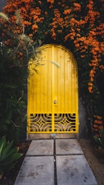 yellow metal door close-up photography