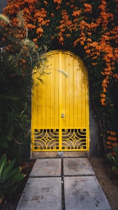 yellow metal door close-up photography