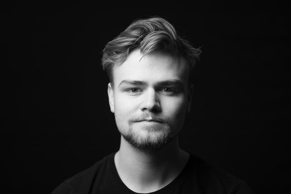 grayscale photography of man in crew-neck shirt