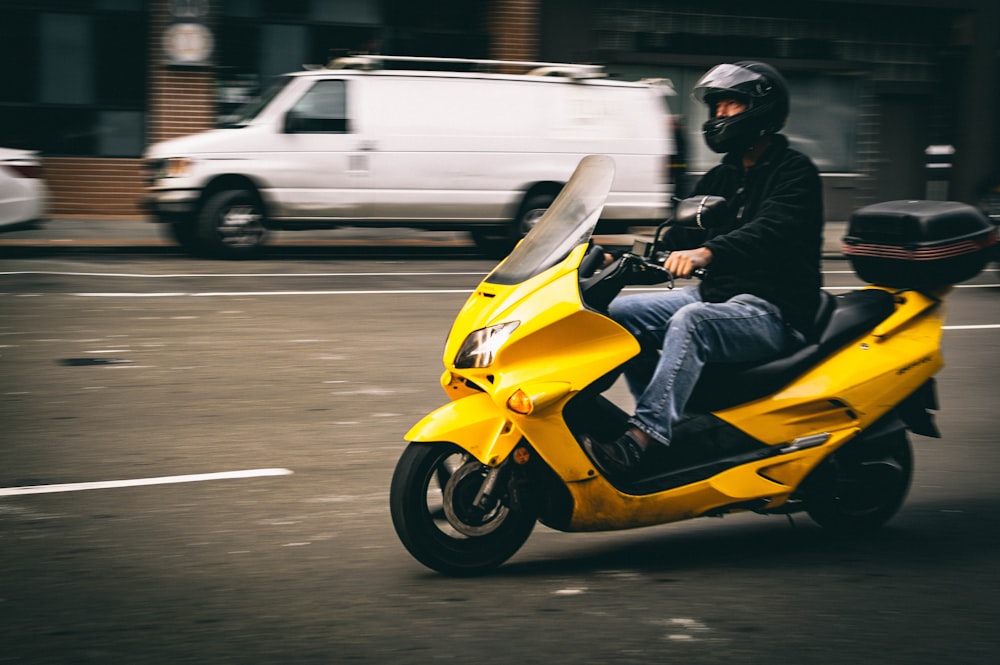 person riding motor scooter