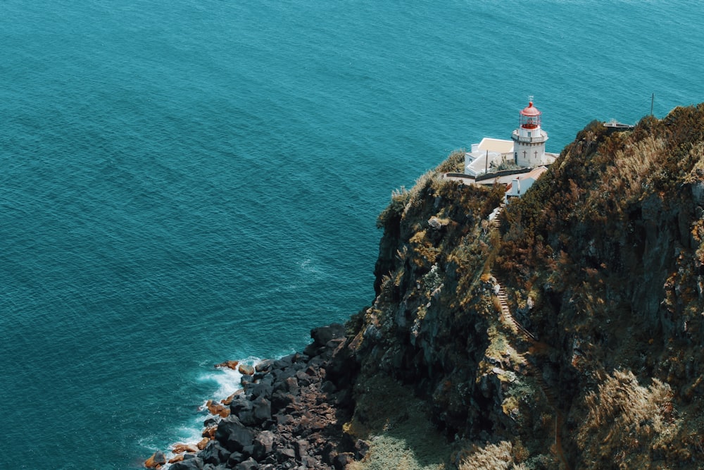 aerial photography of dome cathedral on a mountain cliff