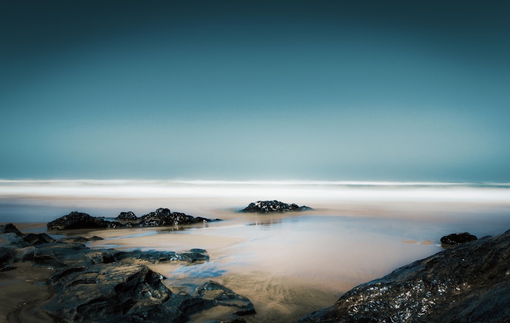 rocks at the shore during daytime