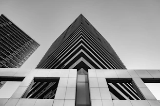 grayscale photography of high rise building
