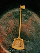 A mysterious black lock with intricate golden designs.