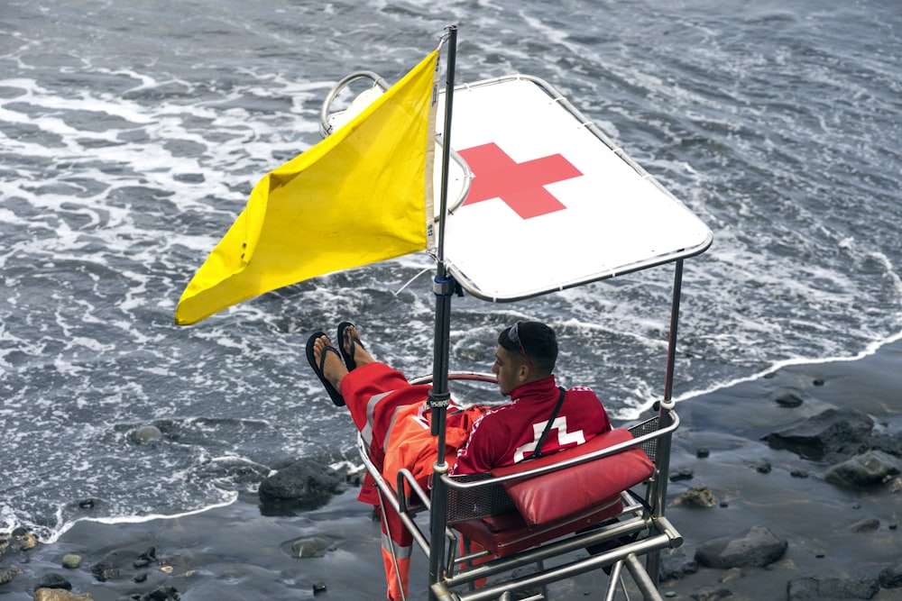 lifeguard sitting in bench