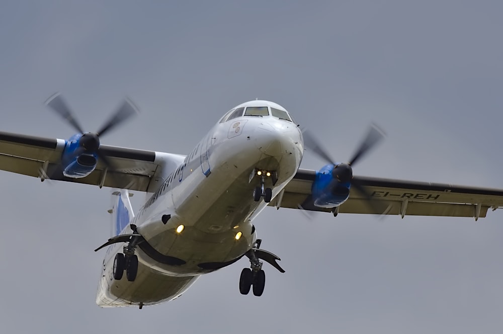 flying white airplane