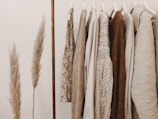 hanged top on brown and white clothes horse