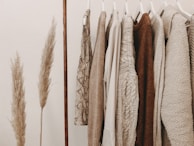 hanged top on brown and white clothes horse