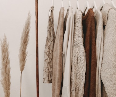 hanged top on brown and white clothes horse