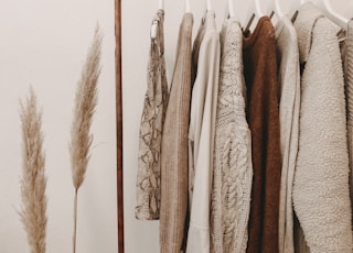 hanged top on brown and white clothes horse