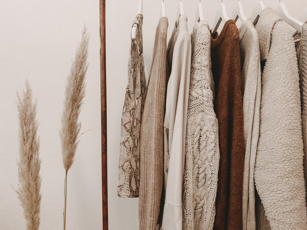 Using a clothes rack is great in keeping your clothes neatly organized | Photo by Alyssa Strohmann