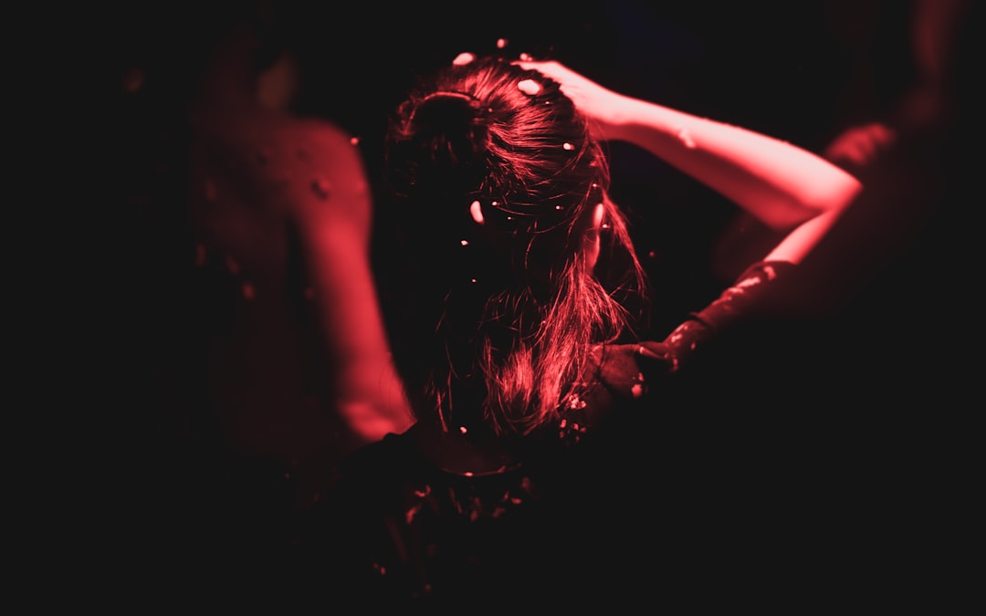 woman facing backward wearing black t-shirt