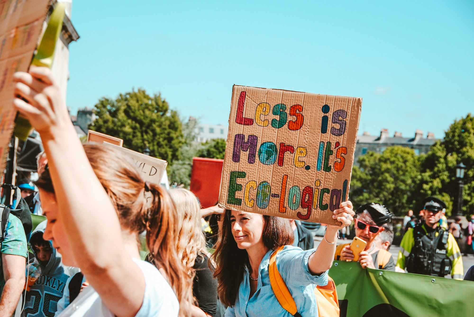 less is more protest sign ecology environmentalism