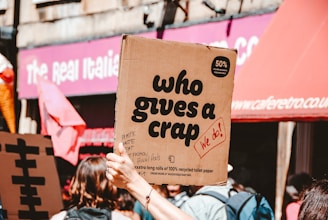 person holding Who Give A crap decor