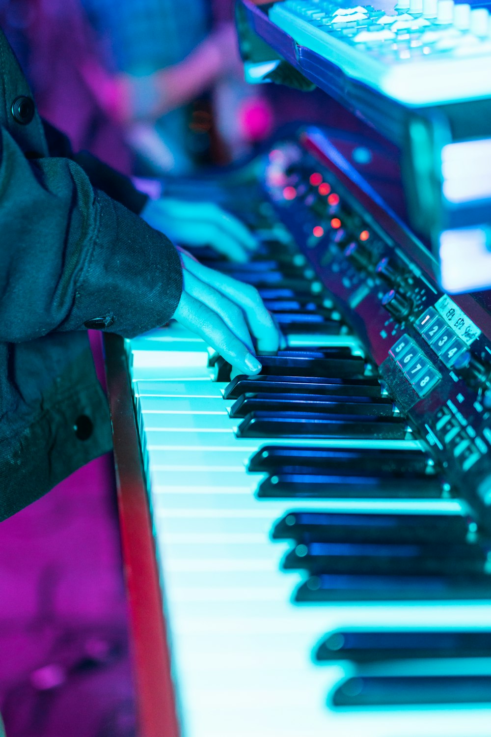 person about to play black and white piano