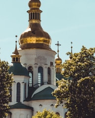 A serene view of Nikolski Hram's historic church building bathed in soft morning light.