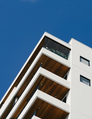 white concrete building with balconies during day