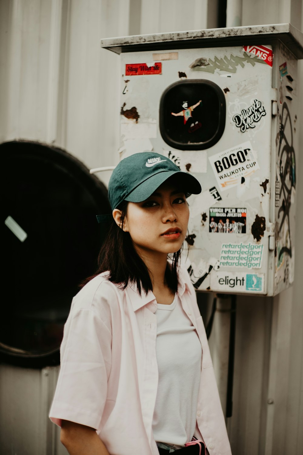 woman wearing green baseball cap