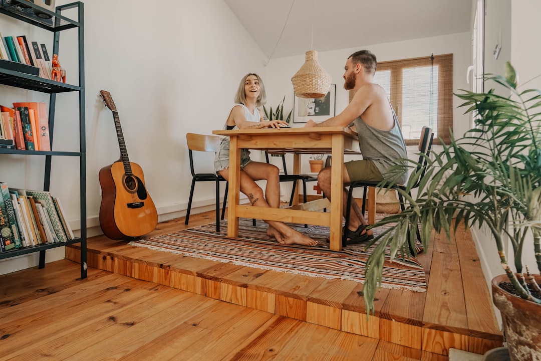 man and woman sitting in front of each other