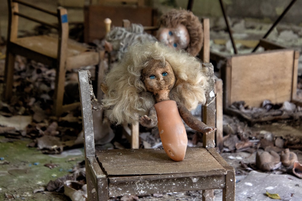 doll on brown table