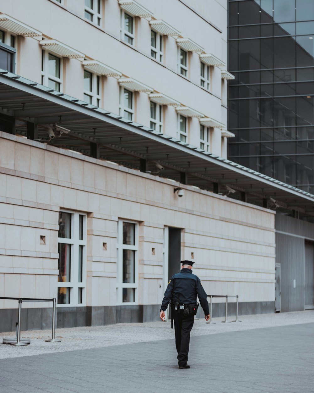 police man walking near building