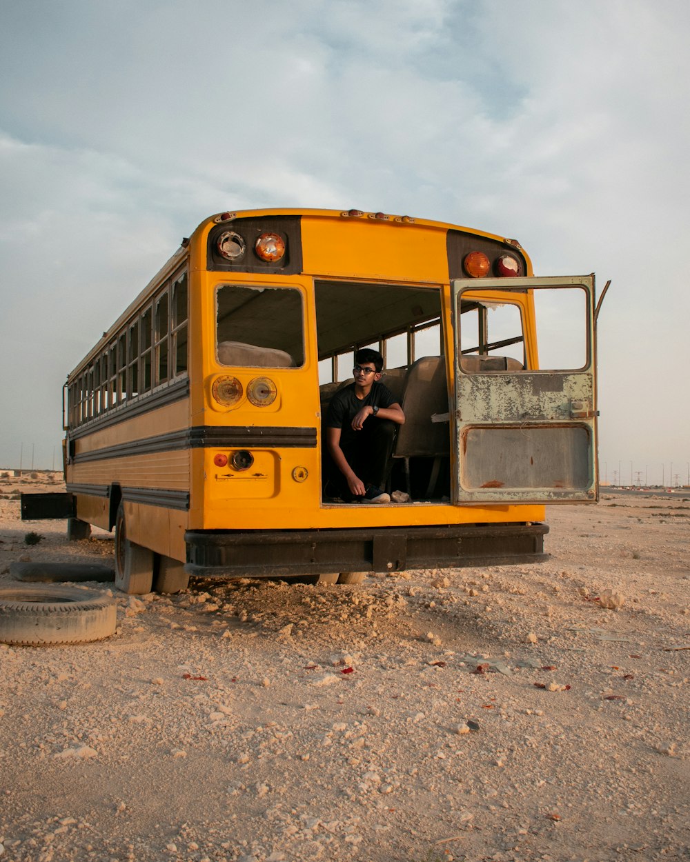 man sitting on school bus