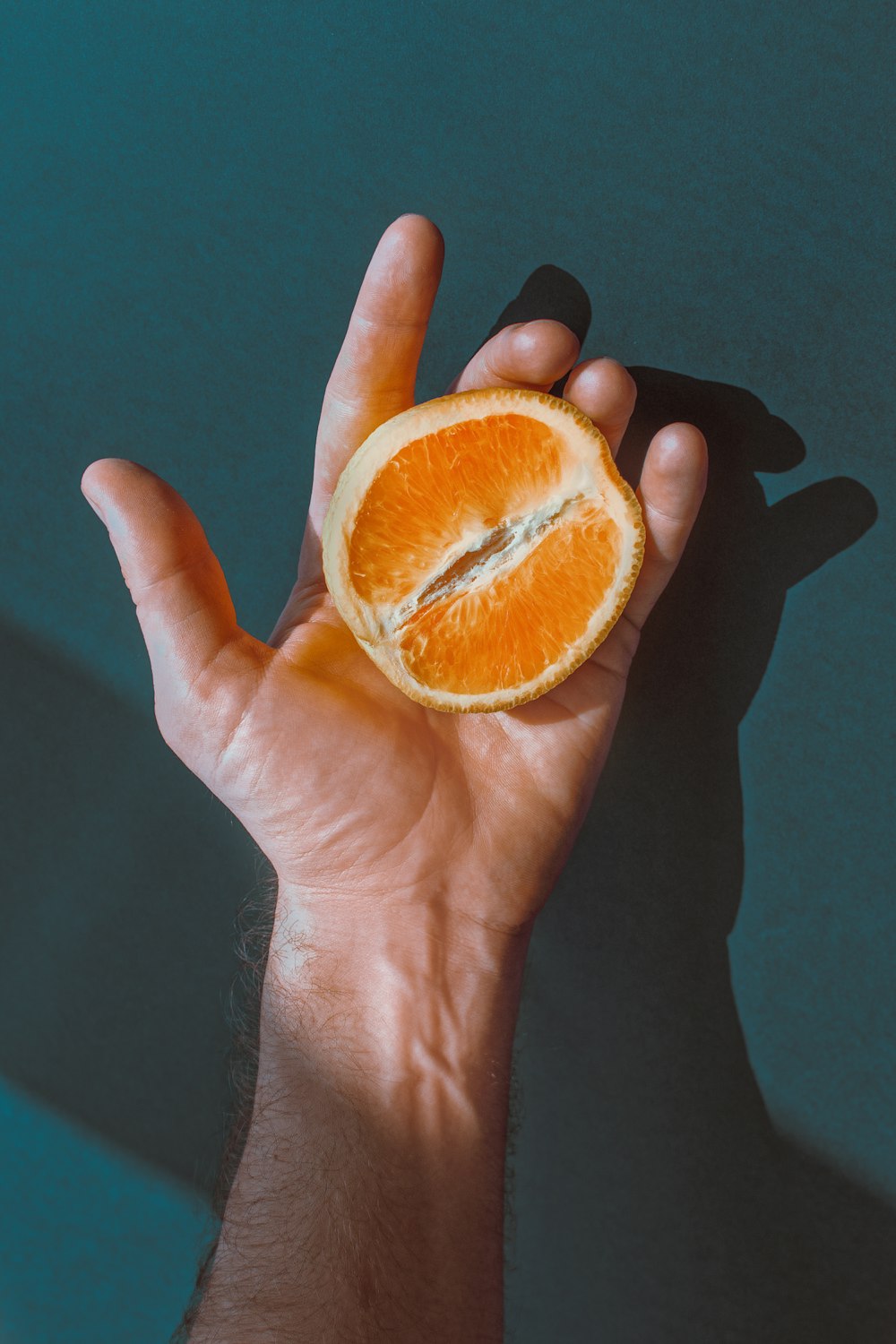 person holding citrus