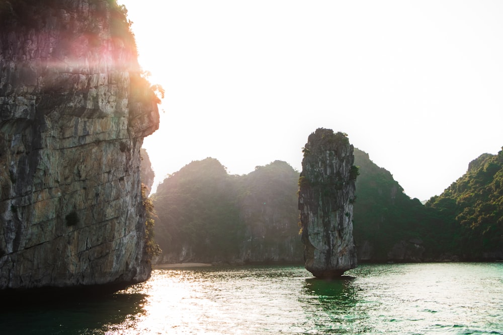 grey cliff near body of water